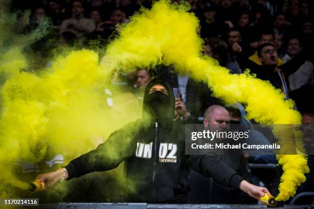 Supporters light flares during an Allsvenskan match between Hammarby IF and AIK at Tele2 Arena on September 22, 2019 in Stockholm, Sweden.