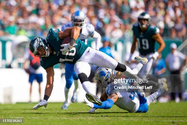 Mack Hollins of the Philadelphia Eagles runs with the ball after a catch and is tackled by Mike Ford of the Detroit Lions in the third quarter at...