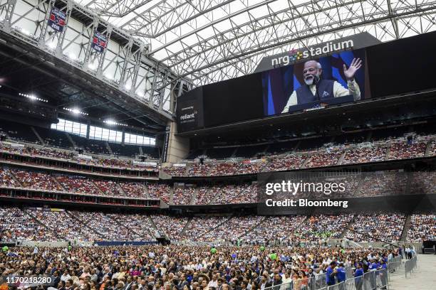 Narendra Modi, India's prime minister, is seen on the large screen as he speaks during the Howdy Modi Community Summit in Houston, Texas, U.S., on...