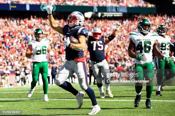 Rex Burkhead of the New England Patriots reacts after scoring a touchdown in the third quarter of a game against the New York Jets at Gillette...