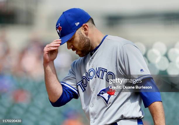 David Phelps of the Toronto Blue Jays adjusts his cap while pitching against the Detroit Tigers at Comerica Park on July 21, 2019 in Detroit,...