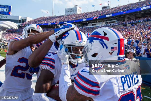 Tre'Davious White of the Buffalo Bills celebrates a game clinching interception with teammates during the fourth quarter against the Cincinnati...