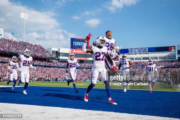 Tre'Davious White of the Buffalo Bills celebrates a game clinching interception with teammates during the fourth quarter against the Cincinnati...