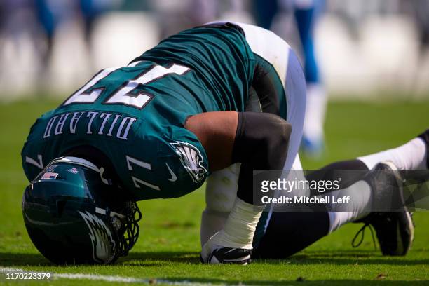 Andre Dillard of the Philadelphia Eagles reacts on the ground after an injury in the second quarter against the Detroit Lions at Lincoln Financial...