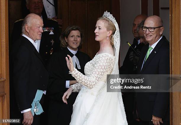 Princess Nathalie zu Sayn-Wittgenstein-Berleburg waits for her bridal bouquet prior to her wedding to Alexander Johannsmann at the evangelic...