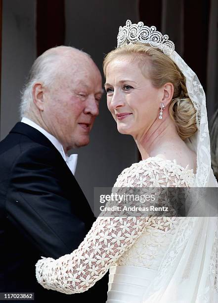 Princess Nathalie zu Sayn-Wittgenstein-Berleburg and her father Richard Prince zu Sayn-Wittgenstein-Berleburg arrive to her wedding to Alexander...