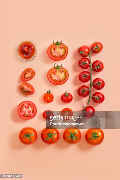 tomato on coloured background. - cherry tomato stock pictures, royalty-free photos & images