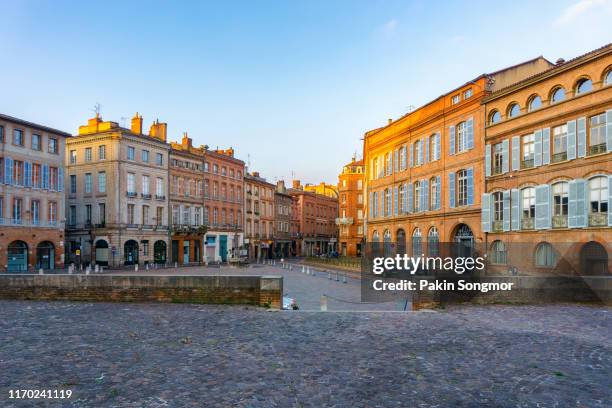 narrow historic street with old buildings in toulouse - toulouse stock pictures, royalty-free photos & images