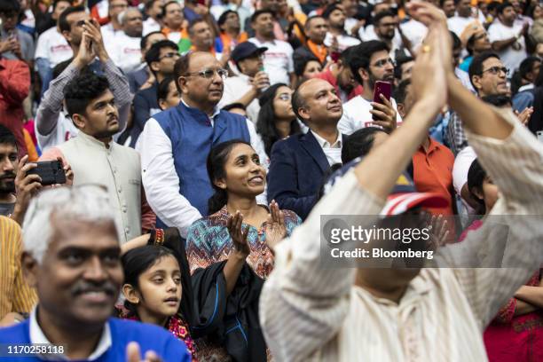 Attendees cheer as Narendra Modi, India's prime minister, not pictured, speaks during the Howdy Modi Community Summit in Houston, Texas, U.S., on...