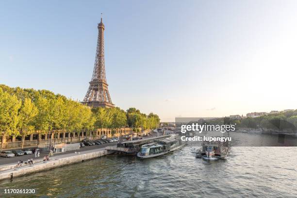 eiffel tower at sunset - seine maritime stock pictures, royalty-free photos & images