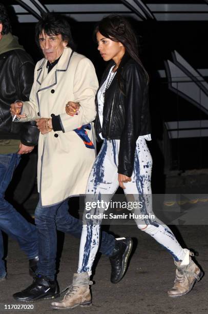 Ronnie Wood and Ana Araujo walk backstage during the Feis Festival in Finsbury Park on June 18, 2011 in London, England.