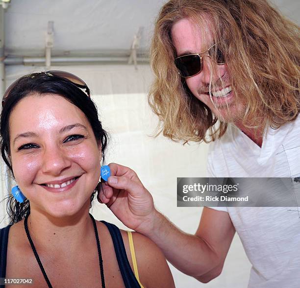 Former American Idol Bucky Covington backstage points out his Bucky Covington earing collecton made by himself with Guitar picks during the First...