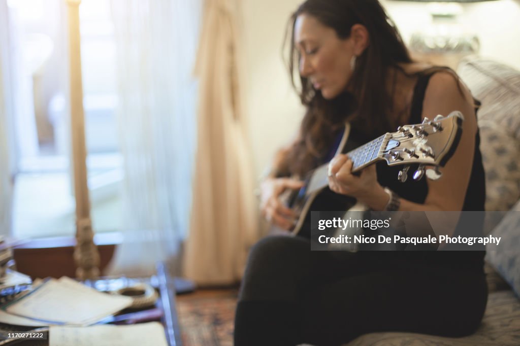 Woman playing guitar