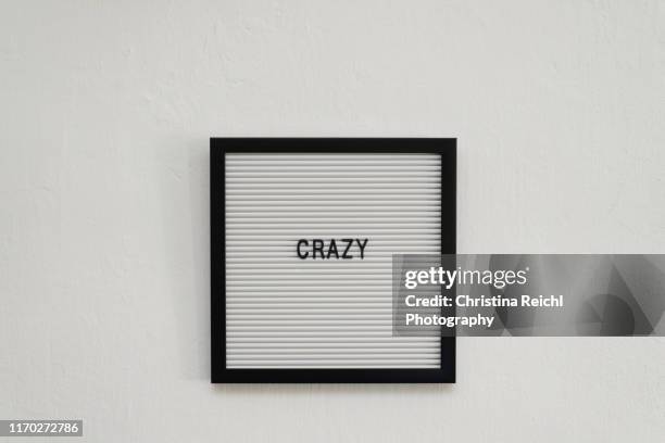 letterboard saying "crazy" - motto stock pictures, royalty-free photos & images