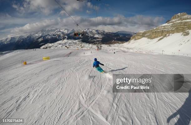 boy skiing at sunny ski resort madonna di campiglio, italian alps mountain of the dolomites italy, europe. - d20 stock pictures, royalty-free photos & images