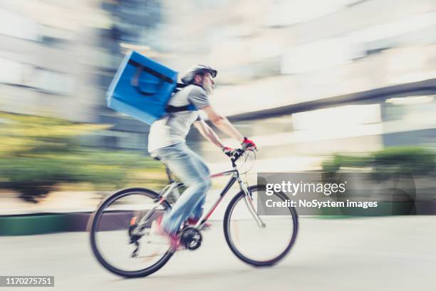 food delivery on bicycle - gig economy stock pictures, royalty-free photos & images