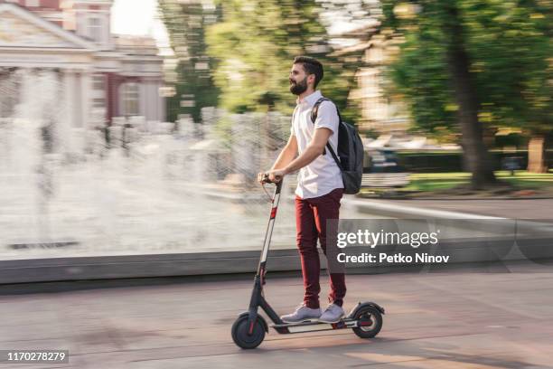 student going to school with his electric scooter - bulgaria people stock pictures, royalty-free photos & images