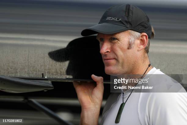 Mahe Drysdale of New Zealand carries his crews boat to the water during Day Two of the 2019 World Rowing Championships on August 26, 2019 in...
