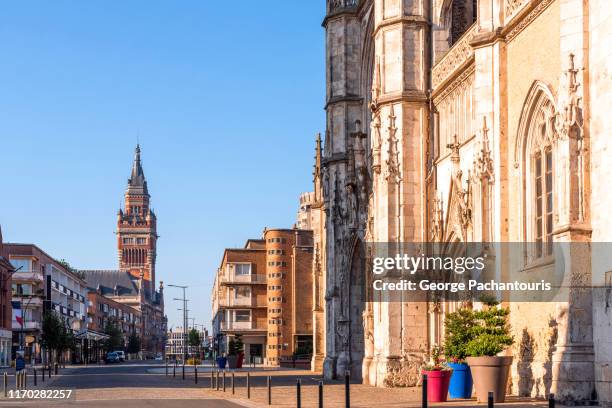 saint eloi church and the city hall tower in dunkirk, france - dunkirk stock pictures, royalty-free photos & images