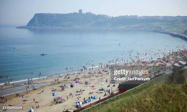 Thousands of people head to Scarborough North Bay beach on August 26, 2019 in Scarborough, United Kingdom. Temperatures have climbed over 30C in...