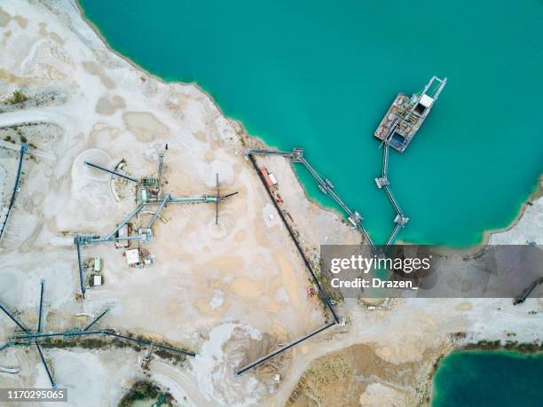 sand mining from the lake and extraction process - open pit mine extracting sand and gravel - sand plants stock pictures, royalty-free photos & images