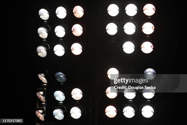 full frame of a overhead stadium spot lights - reflector objeto fabricado fotografías e imágenes de stock