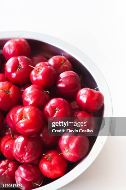 bowl of acerolas - acerola stock pictures, royalty-free photos & images