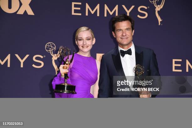 Actress Julia Garner poses with the Emmy for Outstanding Supporting Actress In A Drama Series "Ozark" and Jason Bateman poses with the Emmy for...
