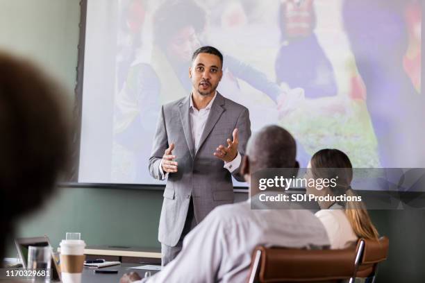 businessman discussing corporate sponsorship opportunities - employer sponsored stock pictures, royalty-free photos & images