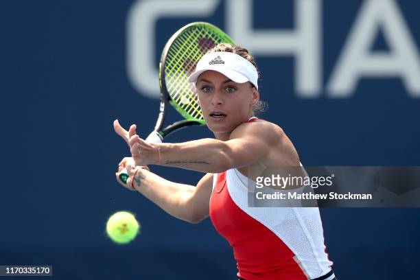Ana Bogdan of Romania returns the ball against Harriet Dart of Great Britain during their Women's Singles first round match during day one of the...