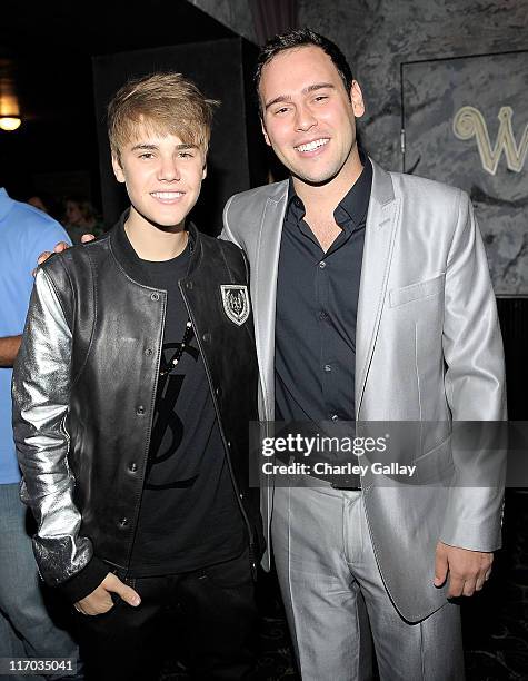 Musician Justin Bieber andScott 'Scooter' Braun attend Scott 'Scooter' Braun's 30th Birthday Party at the Music Box Theater on June 18, 2011 in...