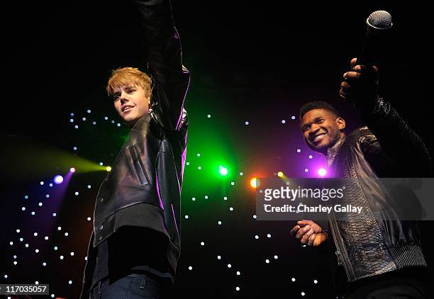 Musicians Justin Bieber and Usher perform at Scott 'Scooter' Braun's 30th Birthday Party at the Music Box Theater on June 18, 2011 in Hollywood,...