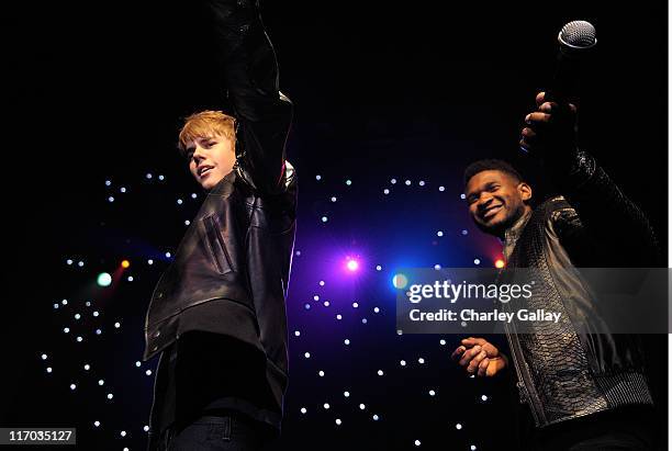 Musicians Justin Bieber and Usher perform at Scott 'Scooter' Braun's 30th Birthday Party at the Music Box Theater on June 18, 2011 in Hollywood,...