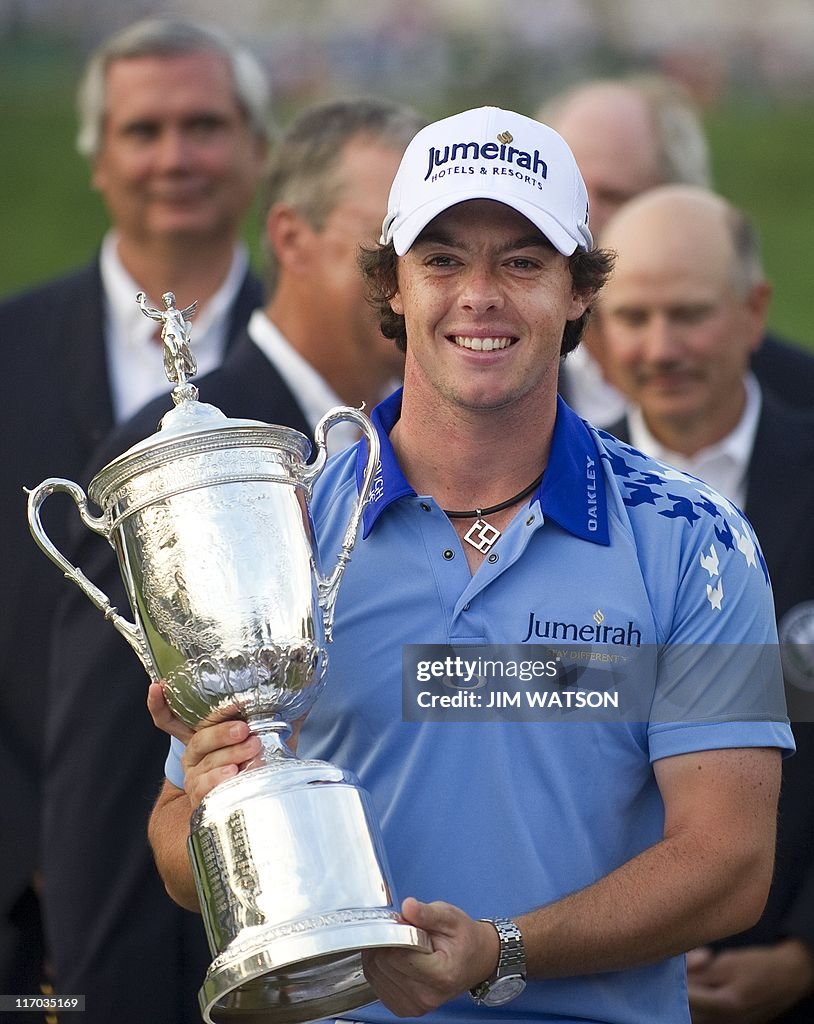 Rory McIlroy of Northern Ireland holds h