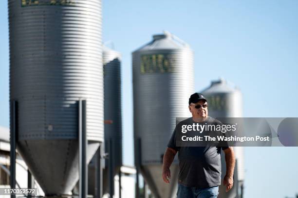 Don Brink, a semi-retired farmer, walks past the old pig barn on his land in Dewald Township, ten miles away from Worthington, Minn., September 4,...