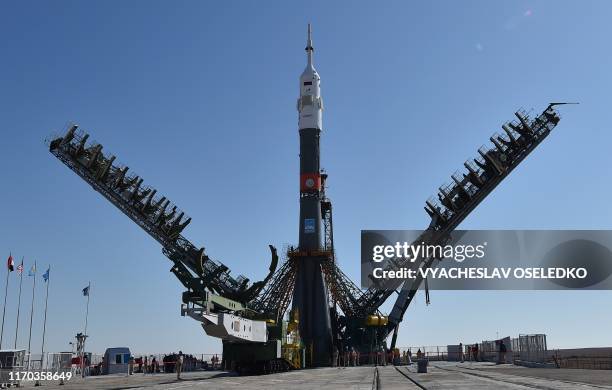 The Soyuz booster rocket FG with Soyuz MS-15 spacecraft is mounted on the launch pad at the Russian-leased Baikonur cosmodrome in Kazakhstan on...