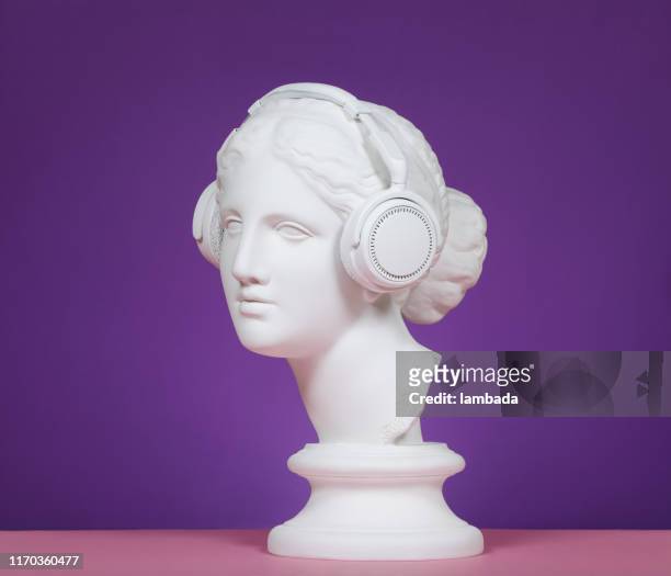 modern greek goddess with headphones - statue stock pictures, royalty-free photos & images