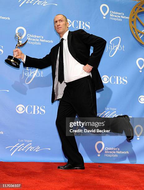 Game show host Ben Bailey poses with the Outstanding Game Show Host award in the press room at the 38th Annual Daytime Entertainment Emmy Awards held...