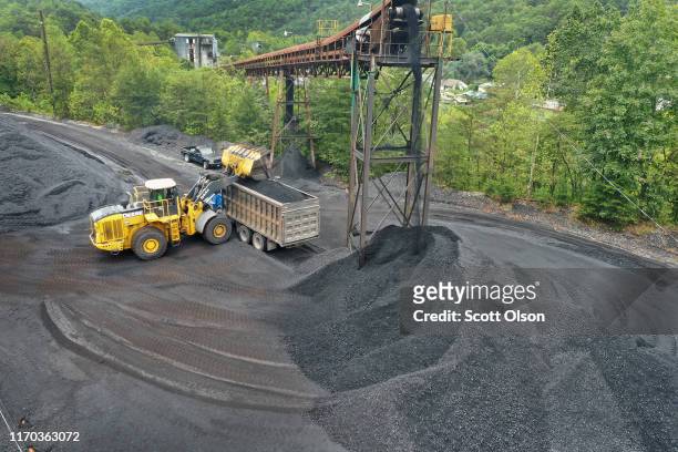 Coal is loaded onto a truck at a mine on August 26, 2019 near Cumberland, Kentucky. Eastern Kentucky, once littered with coal mines, is seeing that...