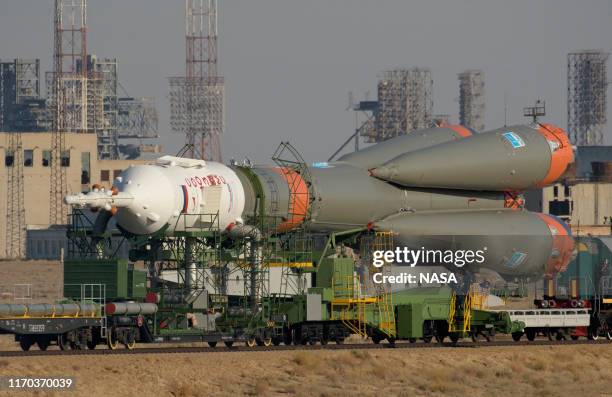 The Soyuz rocket is rolled out by train to the launch pad, September 23, 2019 at the Baikonur Cosmodrome in Kazakhstan. Expedition 61 crewmembers...