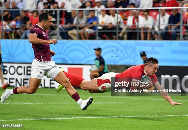 Wales' Josh Adams scores his side's third try during the Rugby World Cup 2019 Group D game between Wales and Georgia at City of Toyota Stadium on...