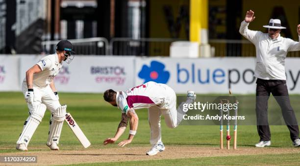 Bowler Doug Bracewell of Northamptonshire runs out George Hankins of Gloucestershire during the Specsavers County Championship Division Two match...