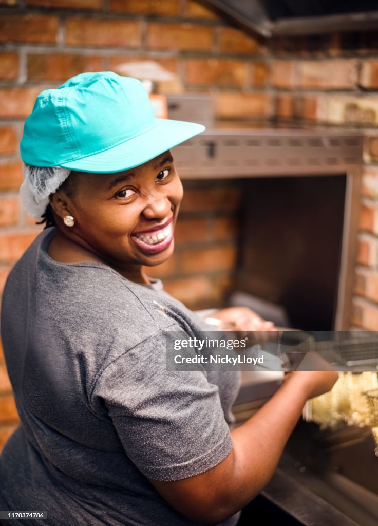 Happy chef in kitchen