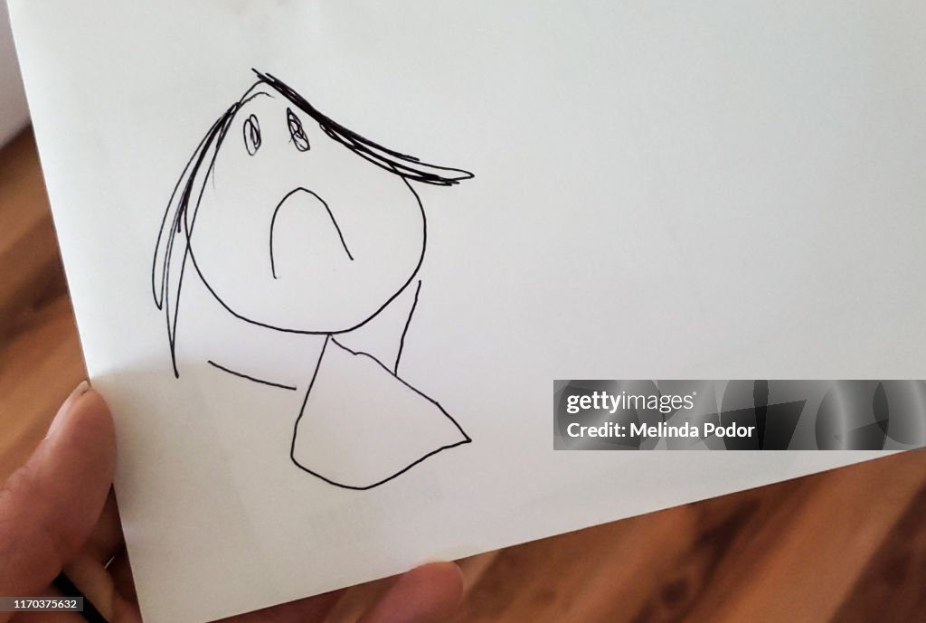 Child's drawing of a sad stick figure