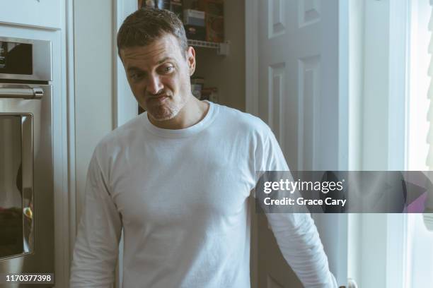 man walks away from pantry unsatisfied - angry faces stock-fotos und bilder