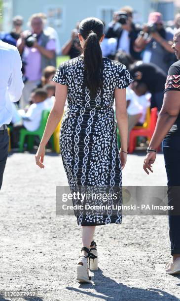 The Duchess of Sussex arrives at the Nyanga Township in Cape Town, South Africa, for a visit to a workshop that teaches children about their rights,...