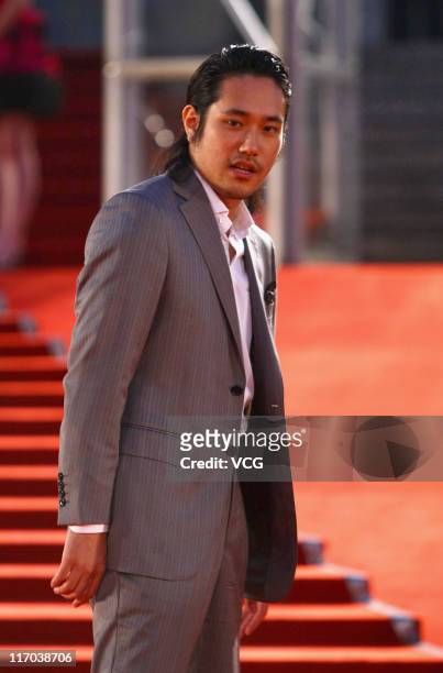 Japanese actor Matsuyama Kenichi arrives on the red carpet for the 14th Shanghai International Film Festival closing ceremony on June 19, 2011 in...