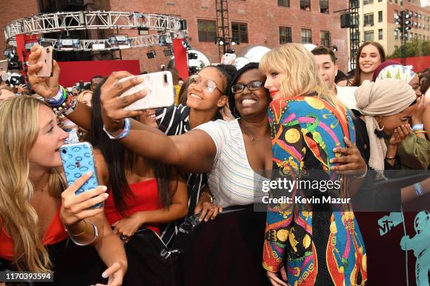 Taylor Swift poses with fans at the 2019 MTV Video Music Awards at Prudential Center on August 26, 2019 in Newark, New Jersey.