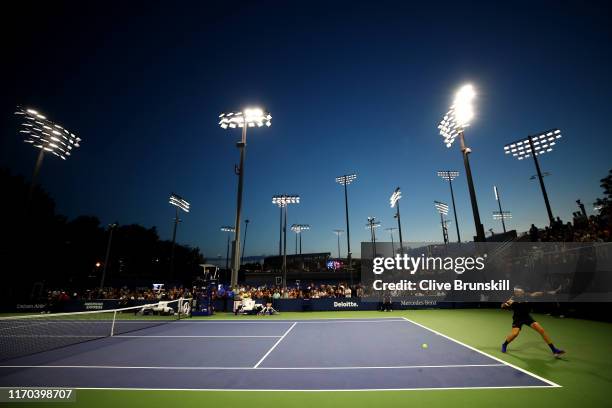 Cameron Norrie of Great Britain returns a shot during his men's singles first round match against Gregoire Barrere of France during day one of the...