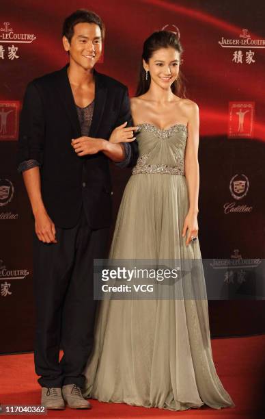 Taiwanese actor Eddie Peng and Hong Kong actress Angelababy arrive at the red carpet of the 14th Shanghai International Film Festival closing...